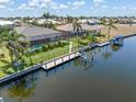 Waterfront home features a fenced yard, dock, and gorgeous canal views at 1330 Mineo Dr, Punta Gorda, FL 33950