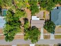 Aerial shot of the property showcasing the home's roof, surrounding trees, and street access at 1510 Orlando Blvd, Port Charlotte, FL 33952