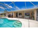 Enjoy the outdoors in this screened in pool and lanai area with tile flooring and plenty of space for entertaining at 3080 Saint James St, Port Charlotte, FL 33952