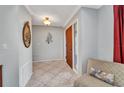 Bright foyer with tile flooring and decorative mirror at 3663 Sterling Rd, Venice, FL 34293