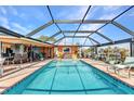 Screened-in pool provides ample space for outdoor relaxation and entertaining along the waterfront at 2100 Via Esplanade, Punta Gorda, FL 33950