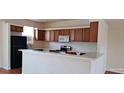 Functional kitchen with ample counter space and a breakfast bar at 2585 Yuma Ave, North Port, FL 34286