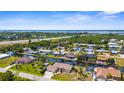 Scenic aerial view of waterfront homes along canals with quick access to the bay at 2911 Riverside Dr, Punta Gorda, FL 33950
