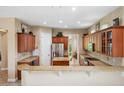 Spacious kitchen featuring granite countertops, stainless steel appliances, and wood cabinetry at 3050 Rivershore Ln, Port Charlotte, FL 33953