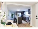 Contemporary kitchen featuring stainless steel appliances, an island with seating, and plenty of counter space at 3502 N Lincoln Ave, Tampa, FL 33607