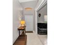 Welcoming entryway with neutral tones, decorative accents, and tiled flooring to the interior living spaces at 3715 Albacete Cir # 93, Punta Gorda, FL 33950