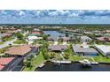 Aerial view of waterfront houses with private docks and boat lifts at 376 Portofino Dr, Punta Gorda, FL 33950