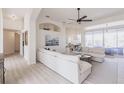 Bright, open-concept living room featuring neutral colors, modern furnishings, and lots of natural light at 3907 San Pietro Ct, Punta Gorda, FL 33950