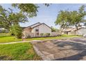 A lovely home with an expansive lawn and large shade trees plus nearby parking at 5301 Linksman Pl, North Port, FL 34287
