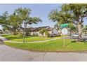 Desirable home exterior featuring mature trees, manicured lawn, and corner lot location at 5301 Linksman Pl, North Port, FL 34287
