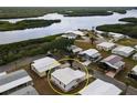 Aerial view of a waterfront neighborhood showcasing the home's location and surrounding landscape at 713 Riverview Cir, North Port, FL 34287