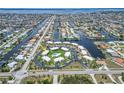 Aerial shot highlighting condo community's waterfront location, landscaped grounds, pool, and proximity to surrounding waterways at 1080 Bal Harbor Blvd # 11C, Punta Gorda, FL 33950