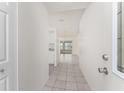 Inviting foyer with neutral tile flooring and a clear view to the living area at 25046 Doredo Dr, Punta Gorda, FL 33955