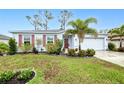 Charming single Gathering home with a well maintained lawn, beautiful landscaping and a two car garage at 25324 Aysen Dr, Punta Gorda, FL 33983