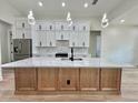 This kitchen is well lit and has white cabinets at 2743 Begonia Ter, North Port, FL 34286