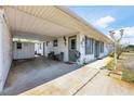 Exterior view of the home with a large covered parking area at 330 Lasayette Ne Dr, Port Charlotte, FL 33952