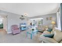 Comfortable living room with tile floors and plenty of seating at 330 Lasayette Ne Dr, Port Charlotte, FL 33952