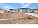 Charming single-story home featuring a new driveway and attached one car garage at 3380 Elkcam Blvd, Port Charlotte, FL 33952