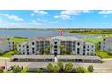 Stunning aerial view of the condo complex, showcasing lush landscaping and convenient covered parking at 43030 Greenway Blvd # 426, Punta Gorda, FL 33982