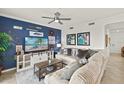 Charming living room with a nautical theme, a large comfy couch, and a flat-screen television at 43030 Greenway Blvd # 426, Punta Gorda, FL 33982