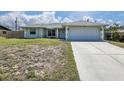 Inviting single-story home with a well-maintained driveway leading to a two-car garage at 5331 Citadel Rd, Venice, FL 34293