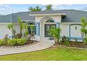Charming single Gathering home featuring a two-car garage and a well-manicured lawn at 1 Sportsman Way, Rotonda West, FL 33947
