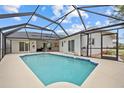 Private screened-in pool with spacious patio area, perfect for outdoor entertaining and relaxation at 1 Sportsman Way, Rotonda West, FL 33947