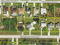 Aerial view of property with a star placed on top of the location with yellow parcel lines on each of the neighboring properties at 10112 Willmington Blvd, Englewood, FL 34224
