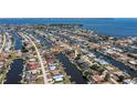 Wide aerial shot of waterfront community, highlighting canal access and residential layout at 110 Colonial Sw St, Port Charlotte, FL 33952