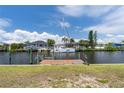 This property includes a private dock with a boat lift and direct access to the Intracoastal Waterway at 18602 Ashcroft Cir, Port Charlotte, FL 33948