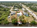 Aerial view of property featuring fenced yard and waterfront dock at 2008 Pellam Blvd, Port Charlotte, FL 33948