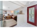 Welcoming foyer with tile floors leading to a living space at 2008 Pellam Blvd, Port Charlotte, FL 33948