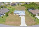 Beautiful overhead view showcasing the well-manicured lawn and the home's proximity to surrounding residences at 27050 Pelotas Dr, Punta Gorda, FL 33983