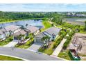 Beautiful aerial view of the property, highlighting its proximity to the lake and walking trails at 281 Potenza Loop, Nokomis, FL 34275