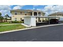 Charming two-story condo with well-maintained landscaping, covered parking, and convenient storage units at 5800 Sabal Trace Dr # 1201, North Port, FL 34287