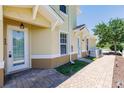 Exterior view of the home with beautiful brick pavers leading to the front door at 16572 San Edmundo Rd # 111, Punta Gorda, FL 33955