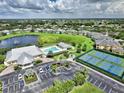 Community amenities include a sparkling pool, tennis courts, clubhouse, and scenic lake views at 2160 Heron Lake Dr # 201, Punta Gorda, FL 33983