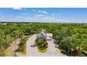 Scenic entrance to a gated community, featuring lush landscaping and a welcoming guardhouse at 2160 Heron Lake Dr # 201, Punta Gorda, FL 33983