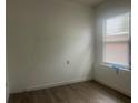 Bright bedroom with wood flooring and a window at 230 Waterway Cir Ne, Port Charlotte, FL 33952