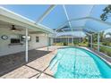 Relaxing screened-in pool area with a covered patio, perfect for outdoor entertainment and leisure at 25449 Doredo Dr, Punta Gorda, FL 33955