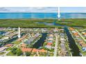 Aerial view of waterfront homes with access to the open bay and gorgeous waterways at 2719 Mayaguana Ct, Punta Gorda, FL 33950
