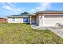 Lovely single-story home with a well-maintained lawn, two-car garage, and inviting front entrance at 3647 Culpepper Ter, North Port, FL 34286