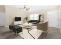 Contemporary living room with a neutral color palette and modern furniture at 4754 Caputo Ave, North Port, FL 34288