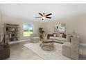 Inviting living room with comfortable seating and a view of the outdoors at 4754 Caputo Ave, North Port, FL 34288