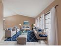 Elegant living room with high ceilings, tile floors, and coordinated furnishings at 4788 Abadan St, North Port, FL 34287