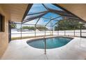 Enclosed in-ground pool with a screened-in lanai, providing a private backyard oasis at 4788 Abadan St, North Port, FL 34287