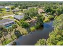 Beautiful aerial view of the backyard and surrounding canal, showcasing the serene waterfront setting at 485 Dorchester St, Port Charlotte, FL 33954