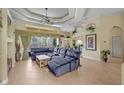 Spacious living room with tile flooring, large window, and coffered ceiling at 13297 Flaherty Ave, Port Charlotte, FL 33981