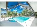 Relaxing screened-in pool area, perfect for enjoying outdoor living and entertaining guests at 18111 Lake Worth Blvd, Port Charlotte, FL 33948