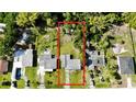 An aerial view of a property showcasing its layout, surrounding greenery, and neighborhood at 23476 Harper Ave, Punta Gorda, FL 33980